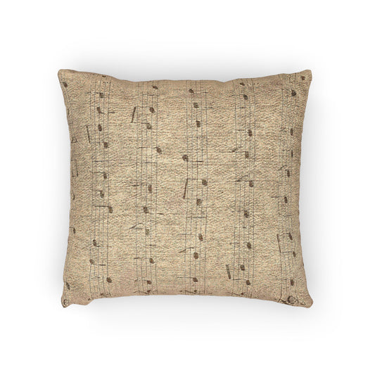 “Woven pillow with soft sepia sheet music printed on aged parchment texture.