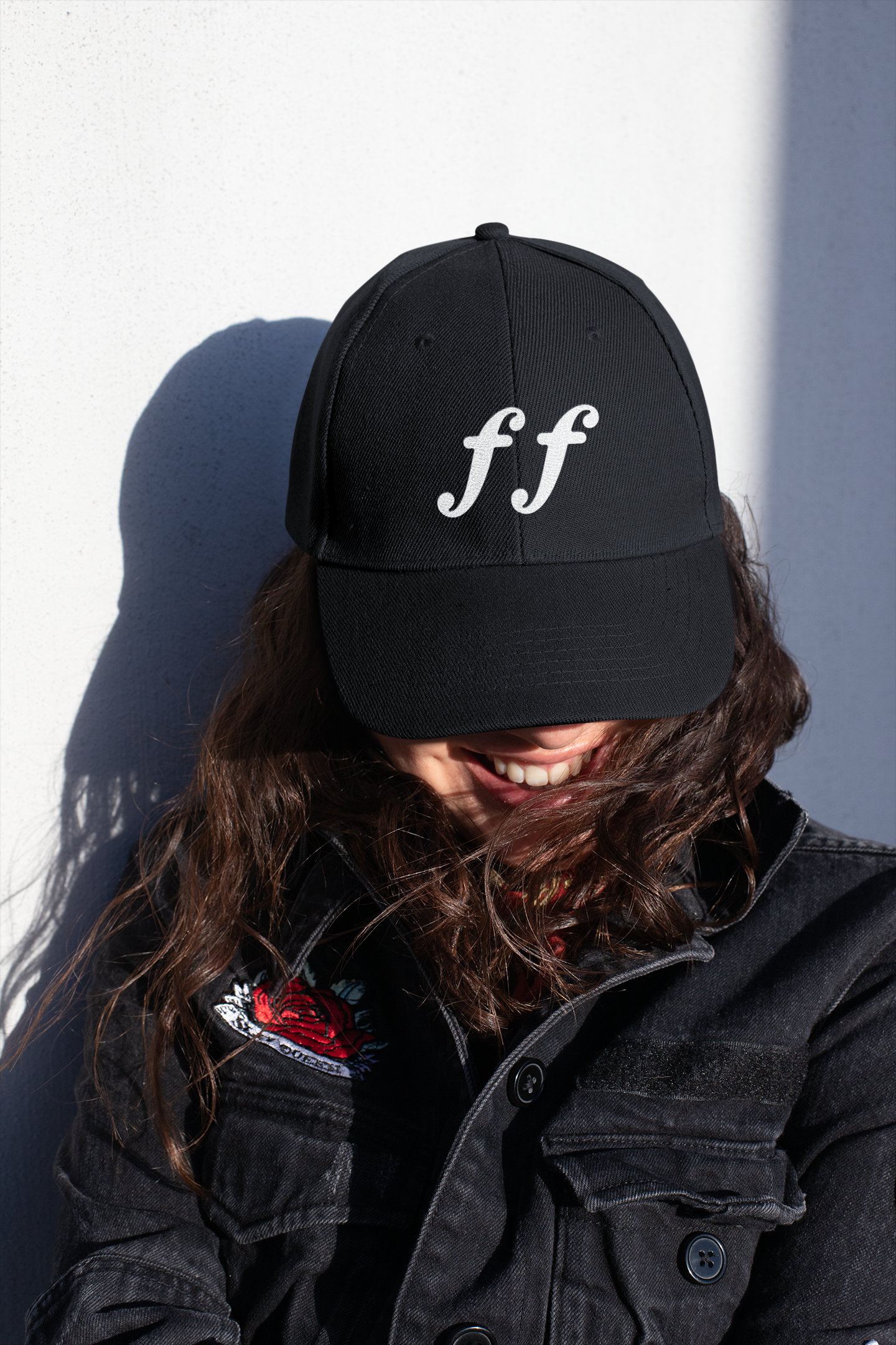 Black snapback hat with bold white embroidered “ff” symbol — fortissimo music marking meaning “very loud.”